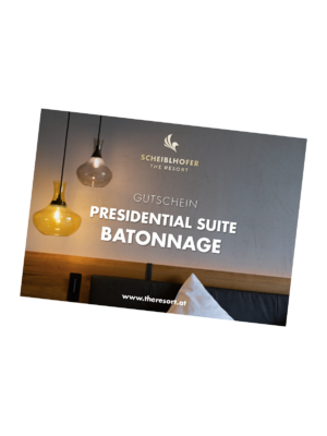 A gift voucher for the Scheiblhofer Resort Presidential Suite Batonnage, with a view of the modern lighting.
