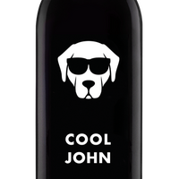 A wine bottle labeled Cool John and a dog with sunglasses and Scheiblhofer The Wine on the bottom.