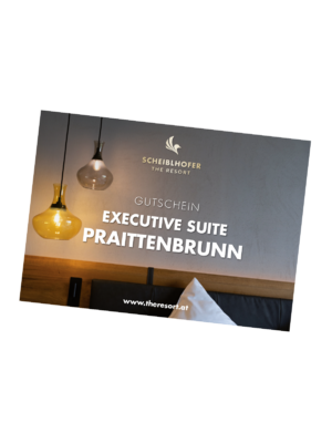 Gift voucher for Scheiblhofer The Resort, Executive Suite Praittenbrunn, with hanging lamps in the background.