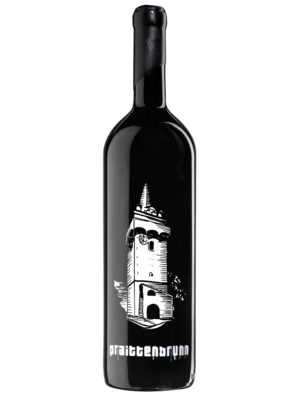 A black wine bottle with a white image of a tower and stylized text underneath on the label.