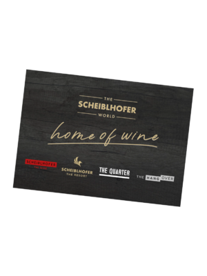 Black sign with golden and white text: Scheidlhofer World, home of wine, and logos at the bottom.